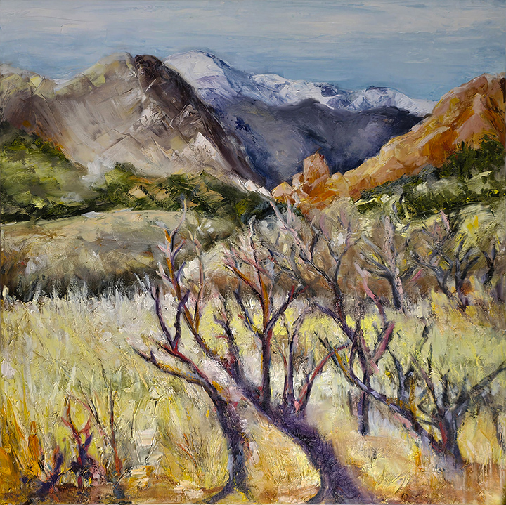 Painting of Pikes Peak in the background.